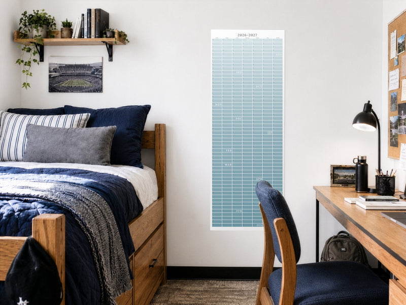 Reef blue 2026-2027 continuous academic wall calendar showing the full year on one sheet with no month breaks, hanging in a college dorm room